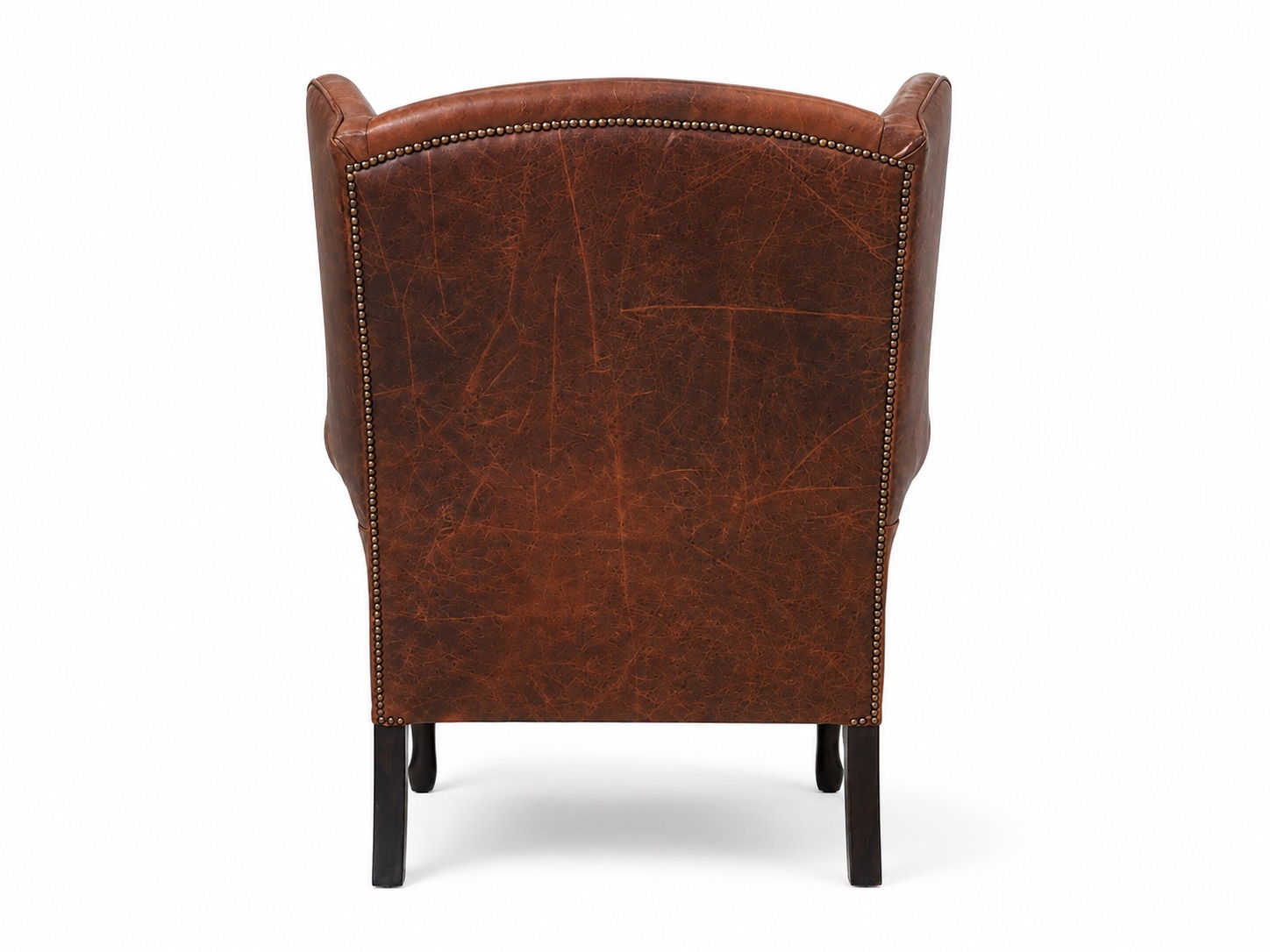 Brown leather wingback armchair rear view