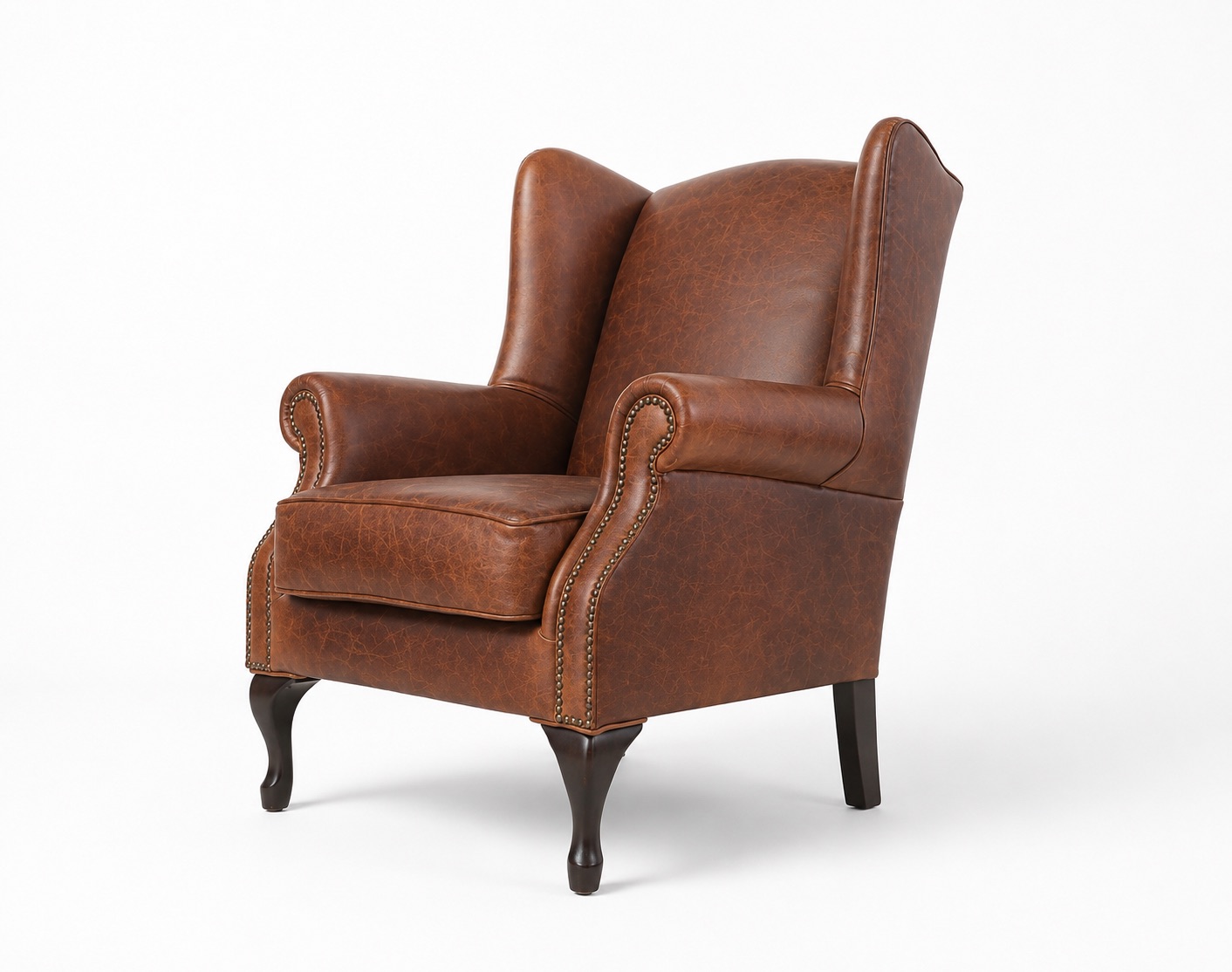 Brown leather wingback armchair right angled front view