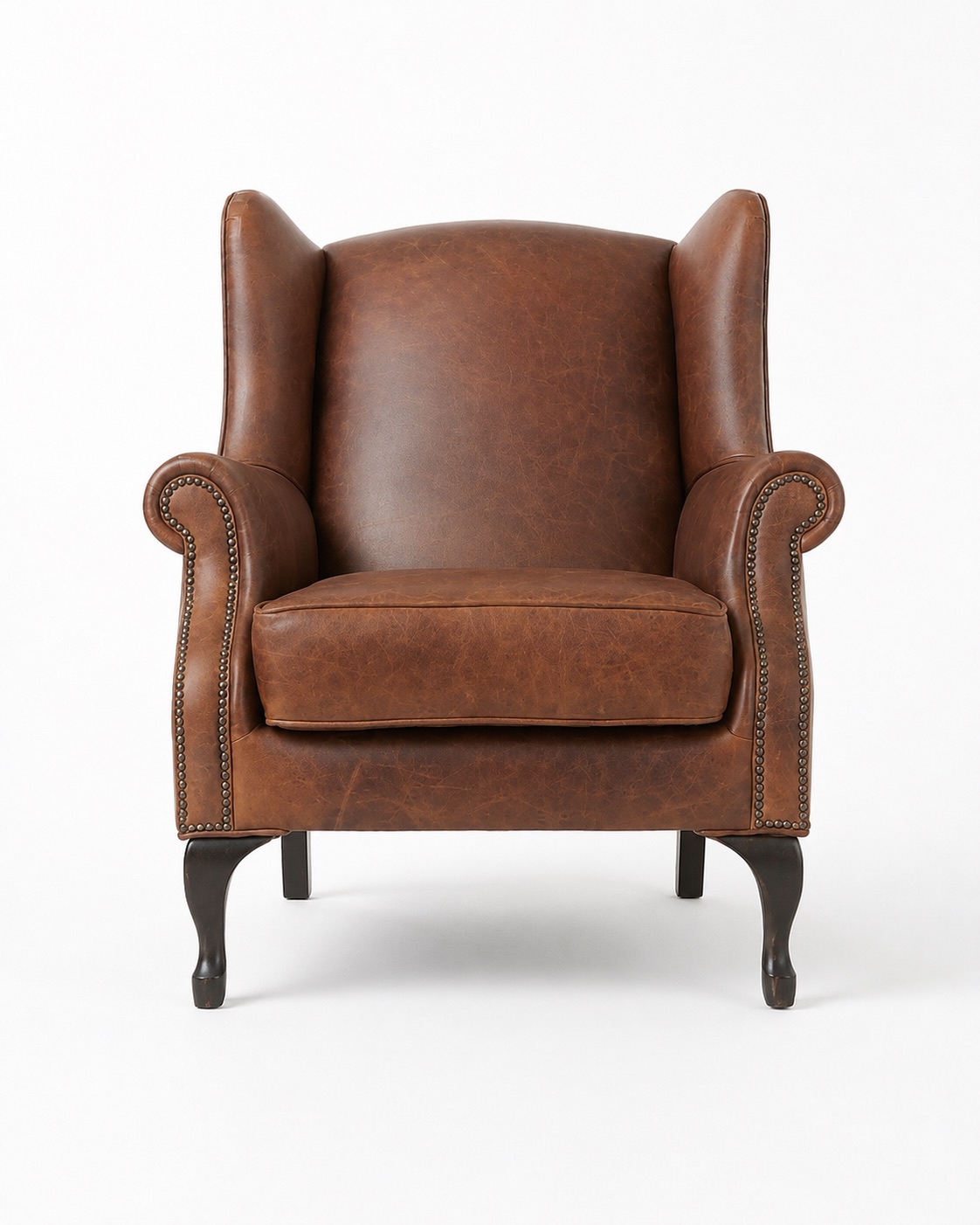 Brown leather wingback armchair front view